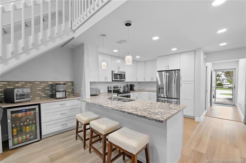 Photo of 3289 NE Holly Creek Drive, Jensen Beach, FL 34957 (MLS # M20055086)