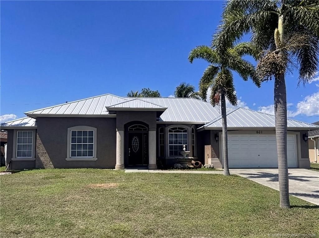 Photo of 631 SW Saragossa Avenue, Port Saint Lucie, FL 34953 (MLS # M20054021)