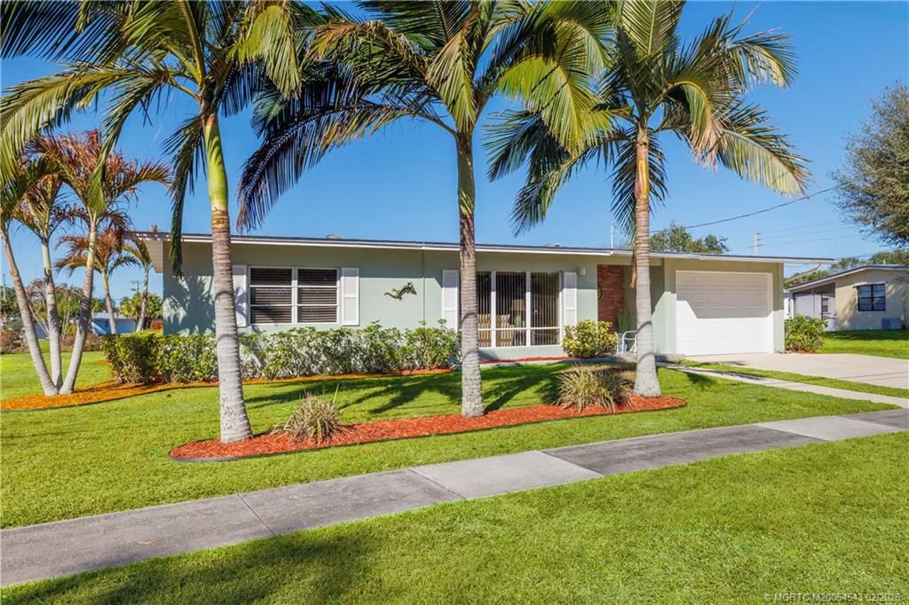 Photo of 2814 SE Treasure Island Road, Port Saint Lucie, FL 34952 (MLS # M20054543)