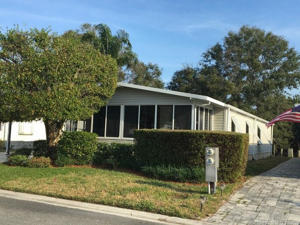 Photo of 14621 SW Divot Drive #A-17, Indiantown, FL 34956 (MLS # M20053873)