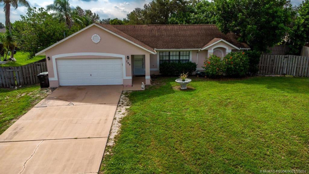 Photo of 708 SW Arkansas Terrace, Port Saint Lucie, FL 34953 (MLS # M20042905)