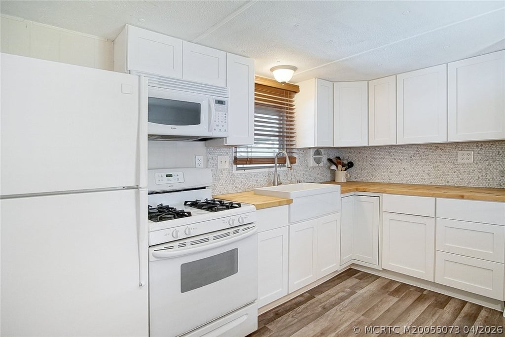 Photo of 4736 NE Blue Heron Lane, Jensen Beach, FL 34957 (MLS # M20055073)