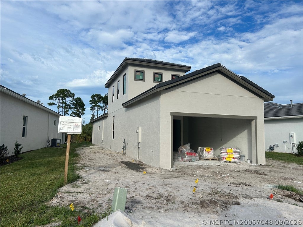 Photo of 431 SE Via Sangro, Port Saint Lucie, FL 34952 (MLS # M20057048)
