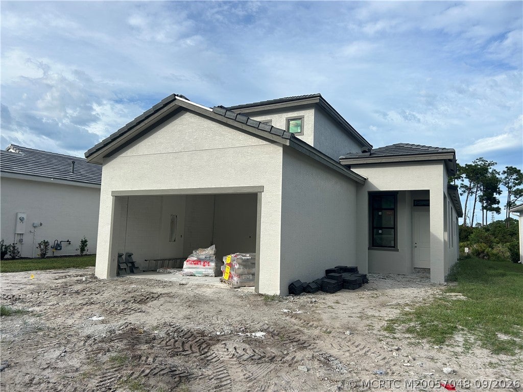 Photo of 431 SE Via Sangro, Port Saint Lucie, FL 34952 (MLS # M20057048)