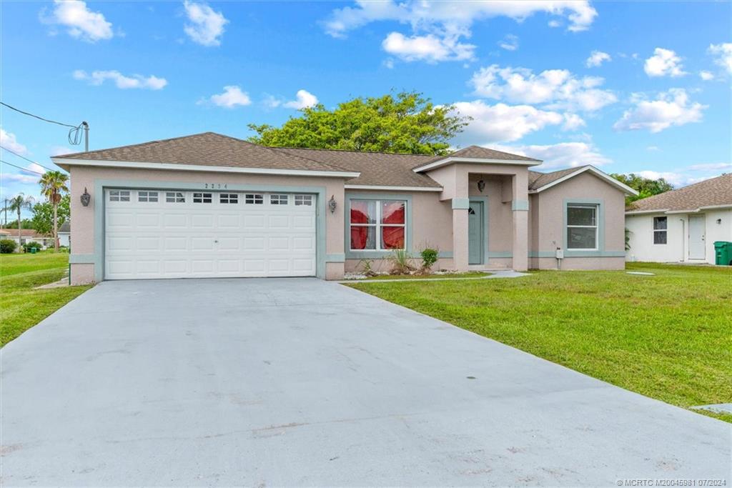 Photo of 2234 SE Friendship Street, Port Saint Lucie, FL 34952 (MLS # M20045981)