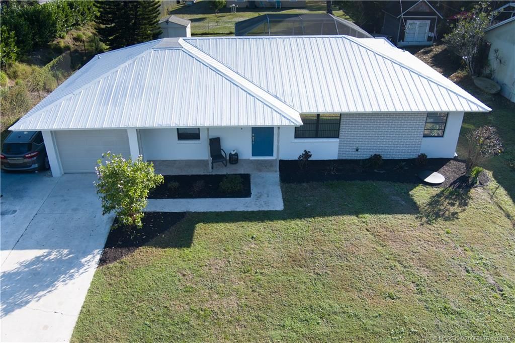 Photo of 1425 SE Morrow Street, Port Saint Lucie, FL 34983 (MLS # M20053376)