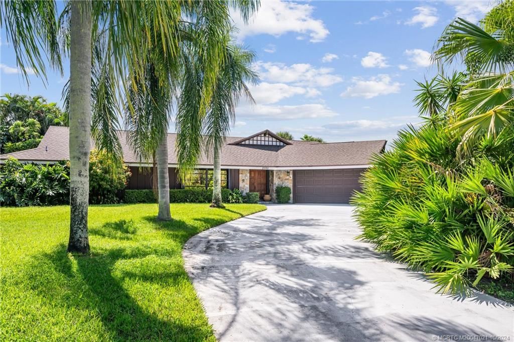 Photo of 2190 NE Pinecrest Lakes Boulevard, Jensen Beach, FL 34957 (MLS # M20047021)