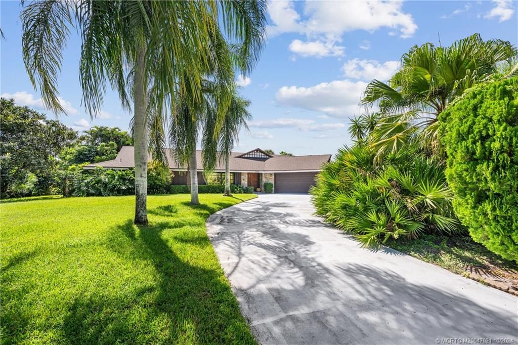 Photo of 2190 NE Pinecrest Lakes Boulevard, Jensen Beach, FL 34957 (MLS # M20047021)