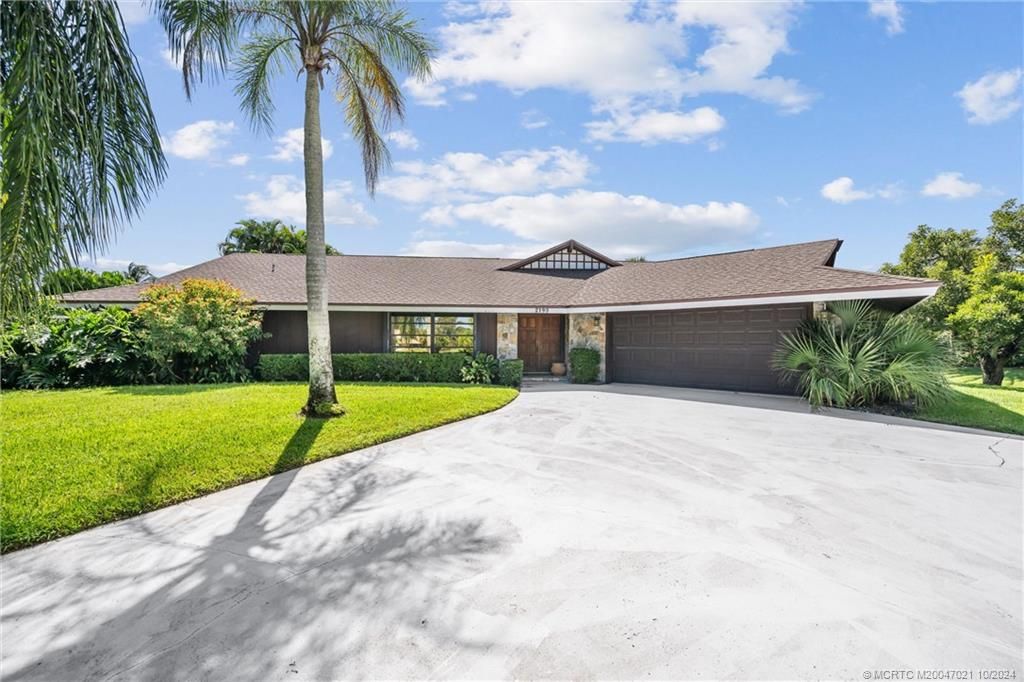 Photo of 2190 NE Pinecrest Lakes Boulevard, Jensen Beach, FL 34957 (MLS # M20047021)