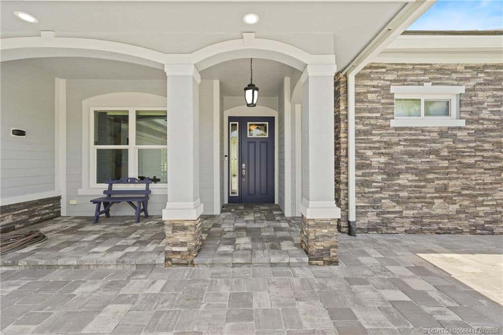 Photo of 1100 SW Squire Johns Lane, Palm City, FL 34990 (MLS # M20056417)