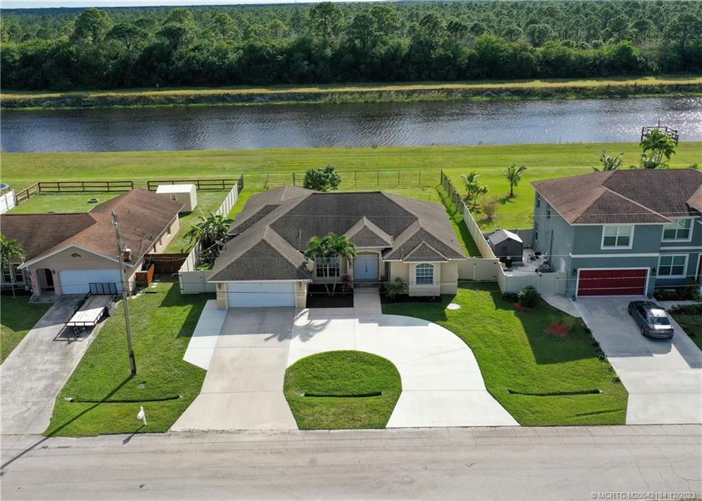 Photo of 898 SW Abbot Avenue, Port Saint Lucie, FL 34953 (MLS # M20042184)