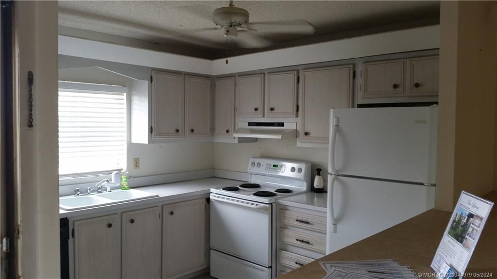 Photo of 1510 NE 12th Terrace #E13, Jensen Beach, FL 34957 (MLS # M20044979)