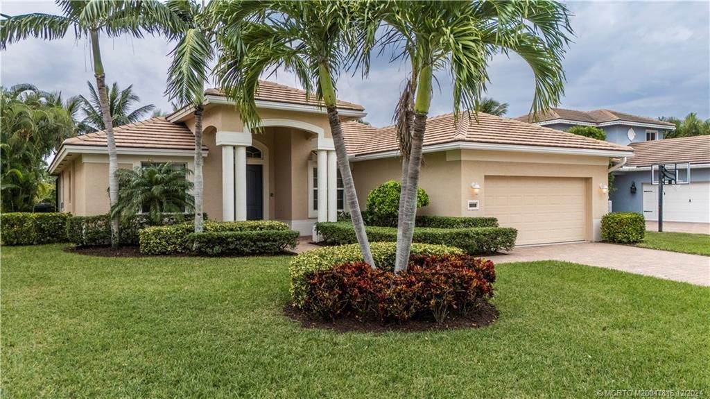 Photo of 528 NW Windflower Terrace, Jensen Beach, FL 34957 (MLS # M20047815)