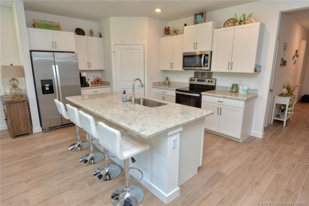 Photo of 1664 NE White Pine Terrace, Jensen Beach, FL 34957 (MLS # M20037647)