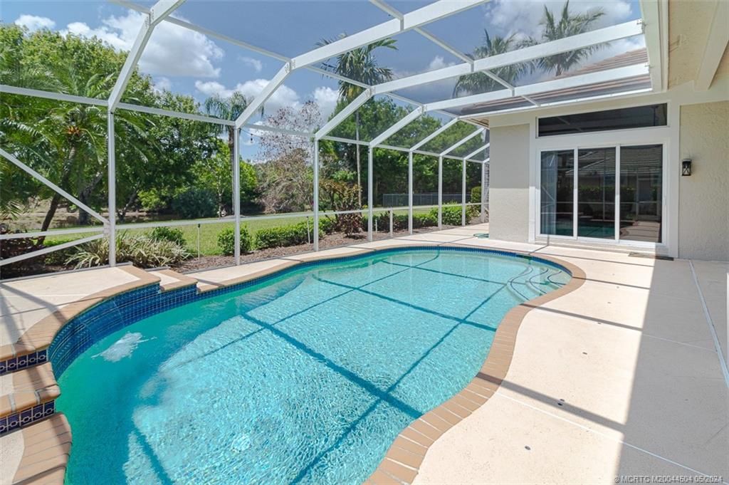 Photo of 5180 SW Hammock Creek Drive, Palm City, FL 34990 (MLS # M20044504)