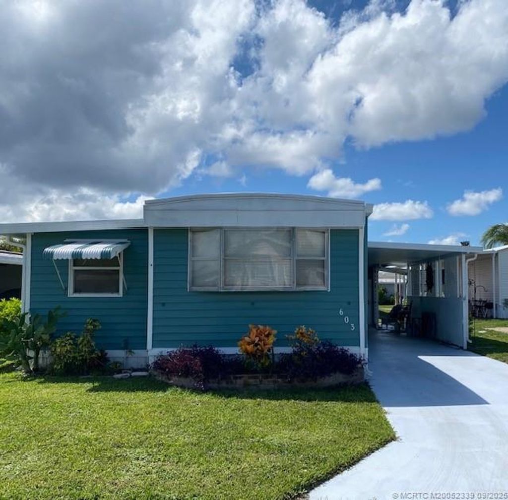 Photo of 603 NE Tahiti Way NE, Jensen Beach, FL 34957 (MLS # M20052339)