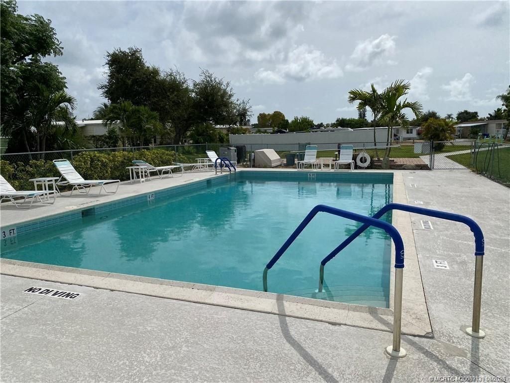 Photo of 603 NE Tahiti Way NE, Jensen Beach, FL 34957 (MLS # M20052339)