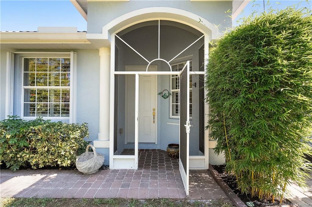 Photo of 490 NW Red Pine Way, Jensen Beach, FL 34957 (MLS # M20047897)