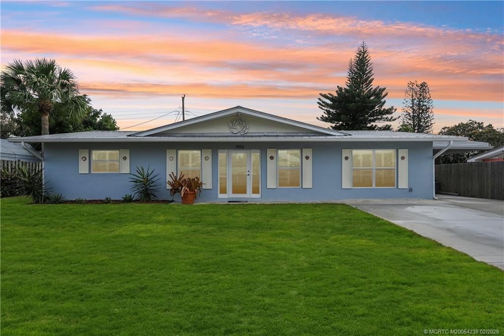 Photo of 1456 NE Hilltop Street, Jensen Beach, FL 34957 (MLS # M20054238)