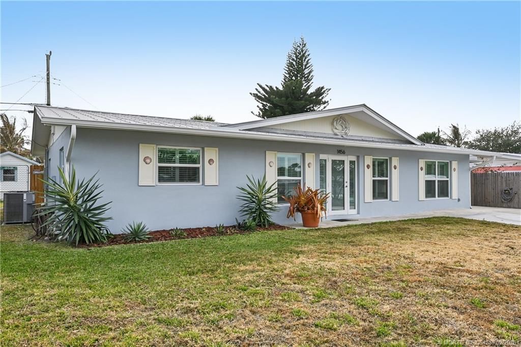 Photo of 1456 NE Hilltop Street, Jensen Beach, FL 34957 (MLS # M20054238)