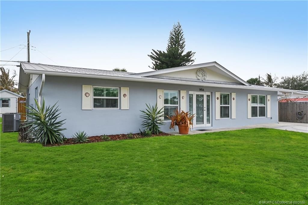 Photo of 1456 NE Hilltop Street, Jensen Beach, FL 34957 (MLS # M20054238)