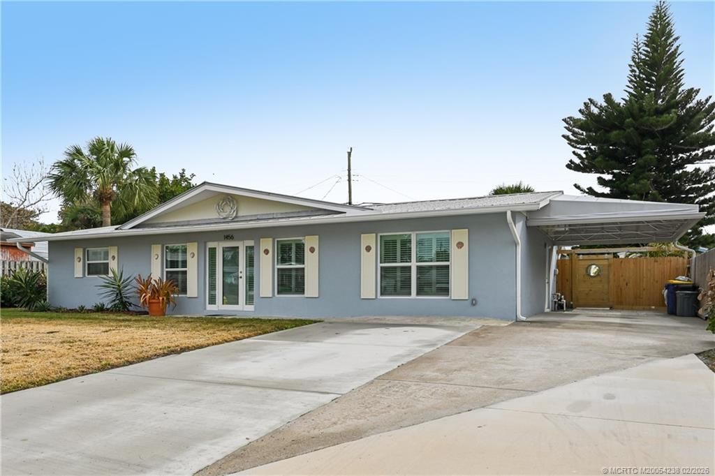 Photo of 1456 NE Hilltop Street, Jensen Beach, FL 34957 (MLS # M20054238)