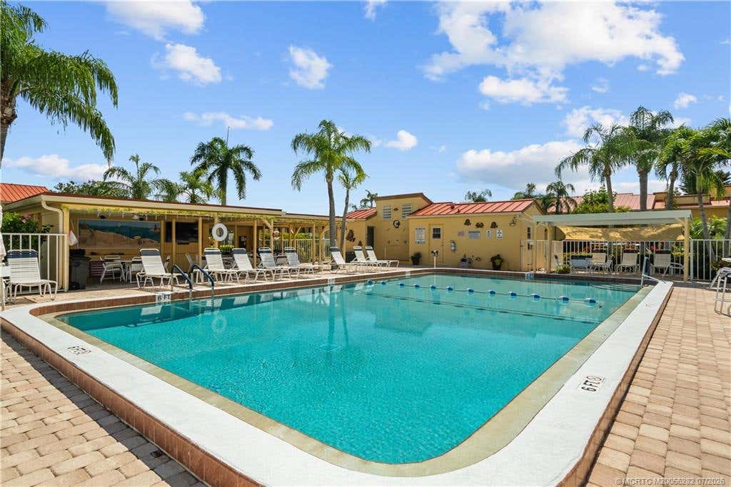 Photo of 5473 SE Miles Grant Road #A105, Stuart, FL 34997 (MLS # M20056282)