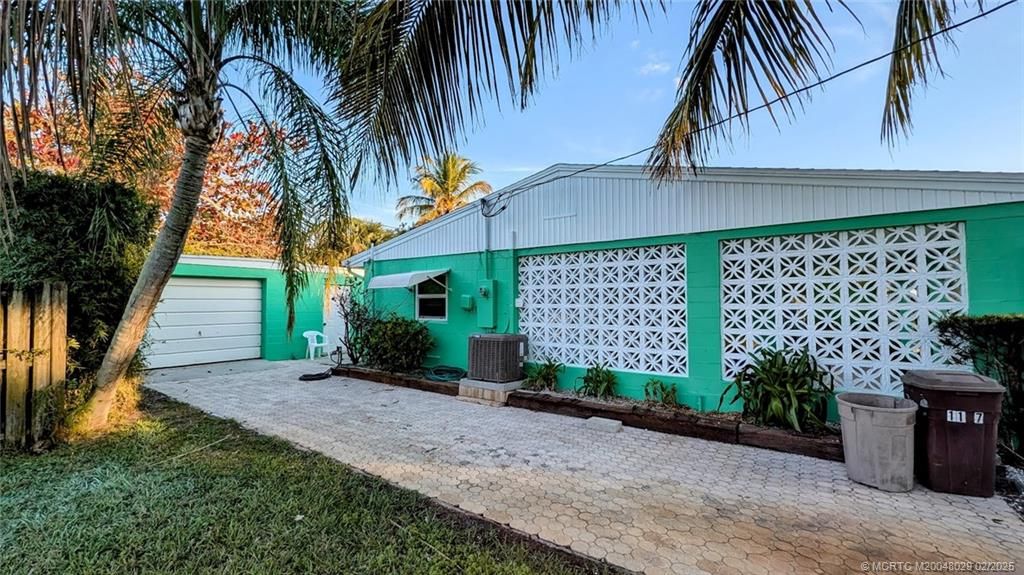 Photo of 1137 NE Kubin Avenue, Jensen Beach, FL 34957 (MLS # M20048029)