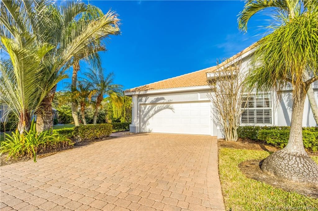 Photo of 691 NW Red Pine Way, Jensen Beach, FL 34957 (MLS # M20042647)