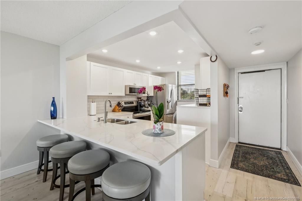 Photo of 9900 S Ocean Drive #102, Jensen Beach, FL 34957 (MLS # M20049049)