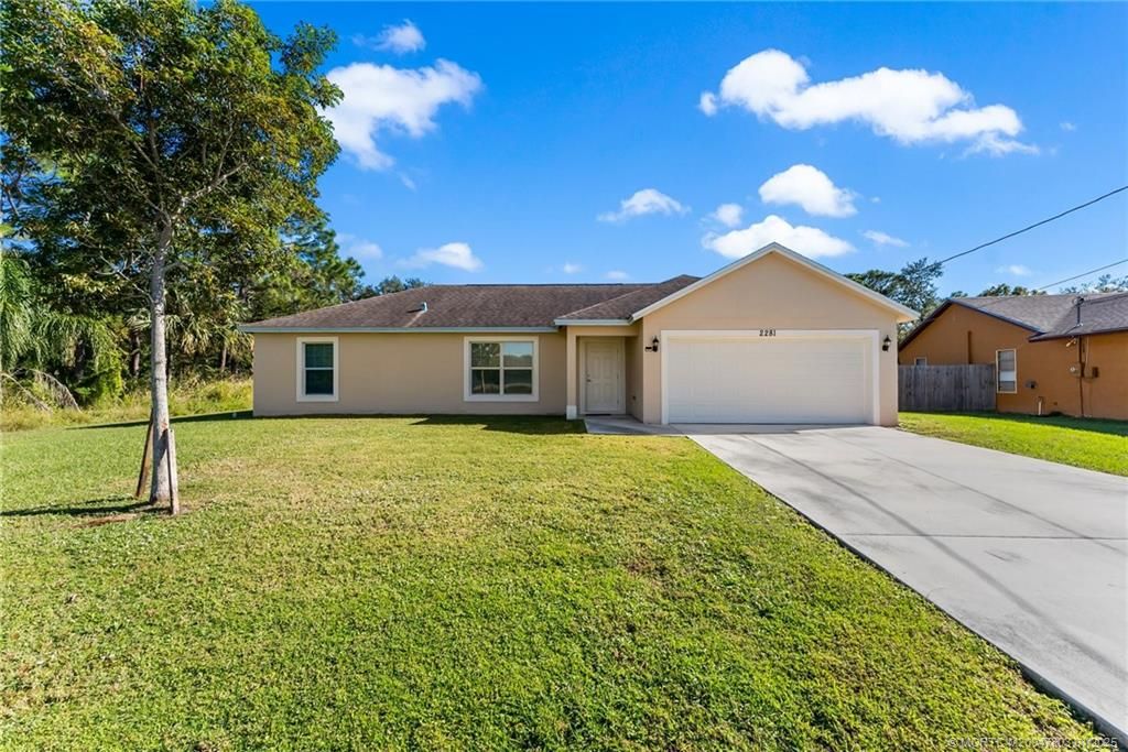 Photo of 2281 SE Monitor Street, Port Saint Lucie, FL 34952 (MLS # M20047803)
