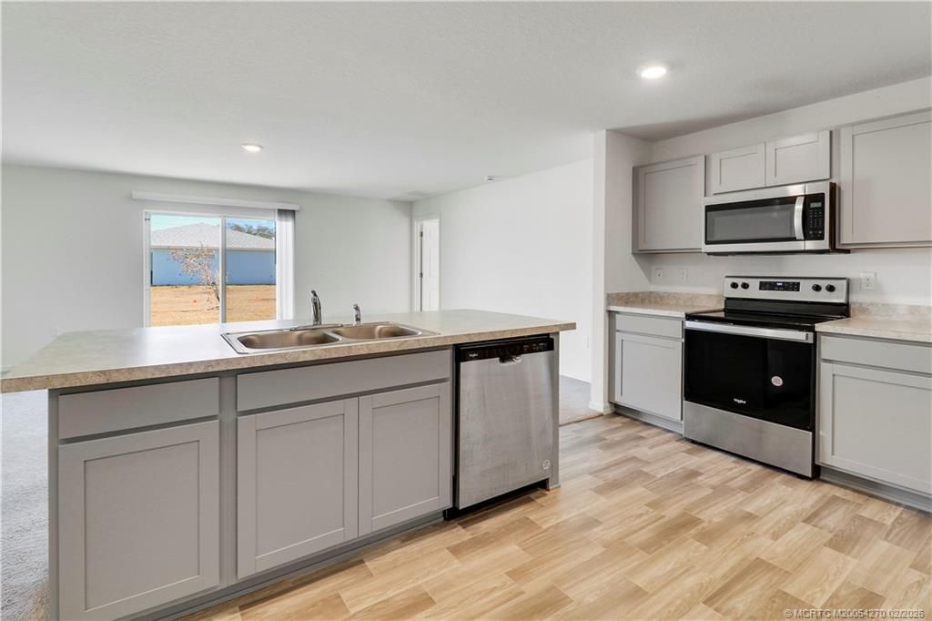 Photo of 411 SW Doreen Street, Port Saint Lucie, FL 34983 (MLS # M20054270)