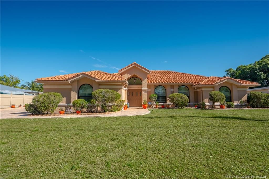 Photo of 382 S Naranja Avenue, Port Saint Lucie, FL 34983 (MLS # M20051341)