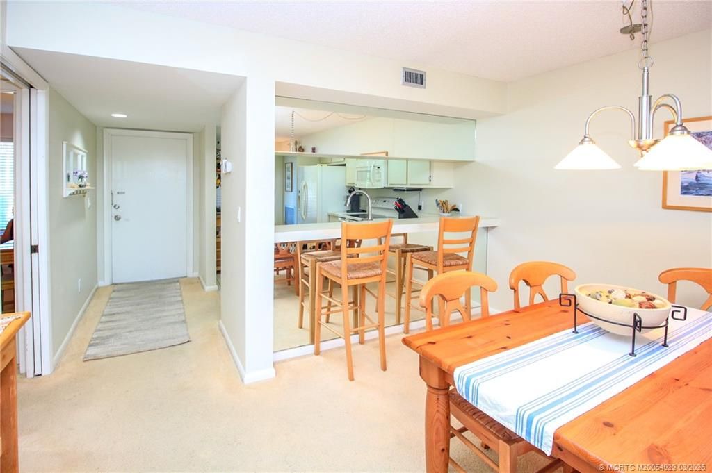 Photo of 4620 NE Sandpebble Trace #104, Stuart, FL 34996 (MLS # M20054929)