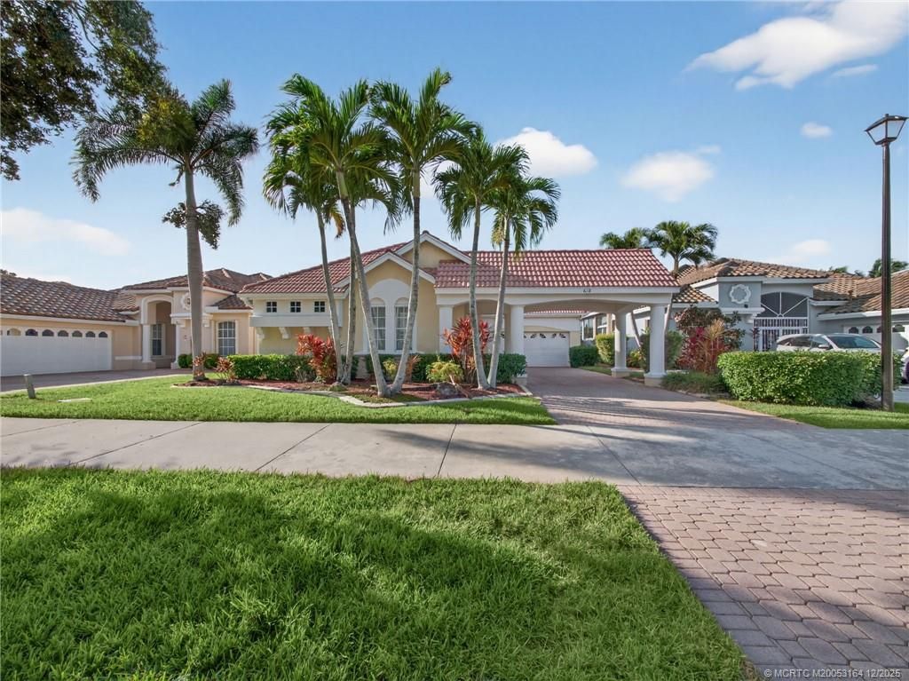 Photo of 618 SW Lake Charles Circle, Port Saint Lucie, FL 34986 (MLS # M20053164)