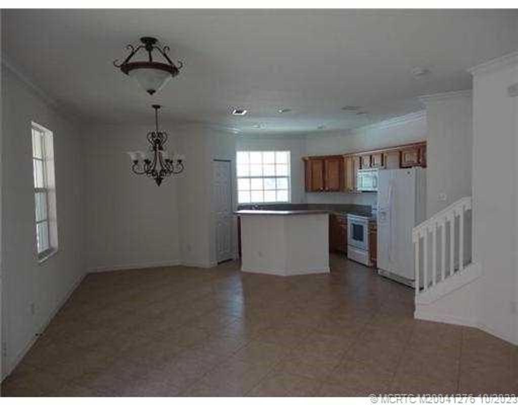 Photo of 2401 SE ruskin Drive, Port Saint Lucie, FL 34951 (MLS # M20041276)