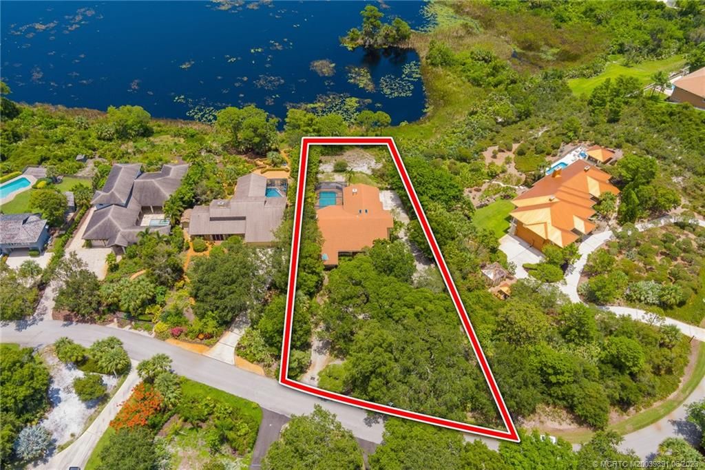 Photo of 3881 NE Sugarhill Avenue, Jensen Beach, FL 34957 (MLS # M20039891)