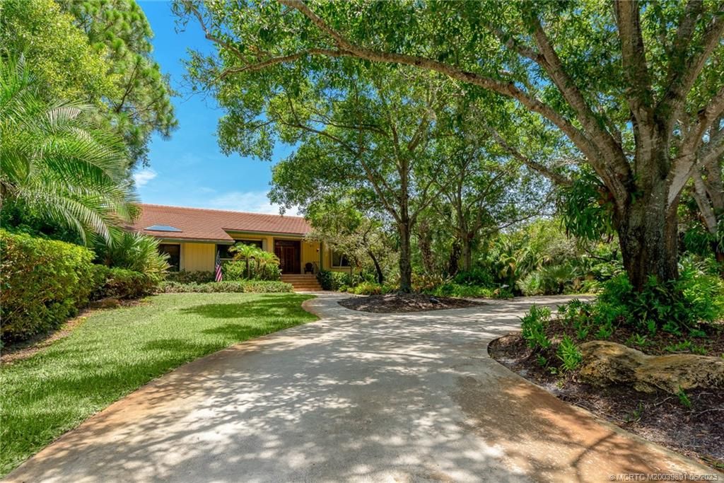 Photo of 3881 NE Sugarhill Avenue, Jensen Beach, FL 34957 (MLS # M20039891)