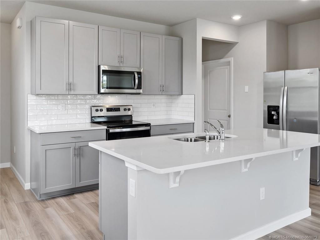 Photo of 240 Osprey Preserve Boulevard, Jensen Beach, FL 34957 (MLS # M20039533)