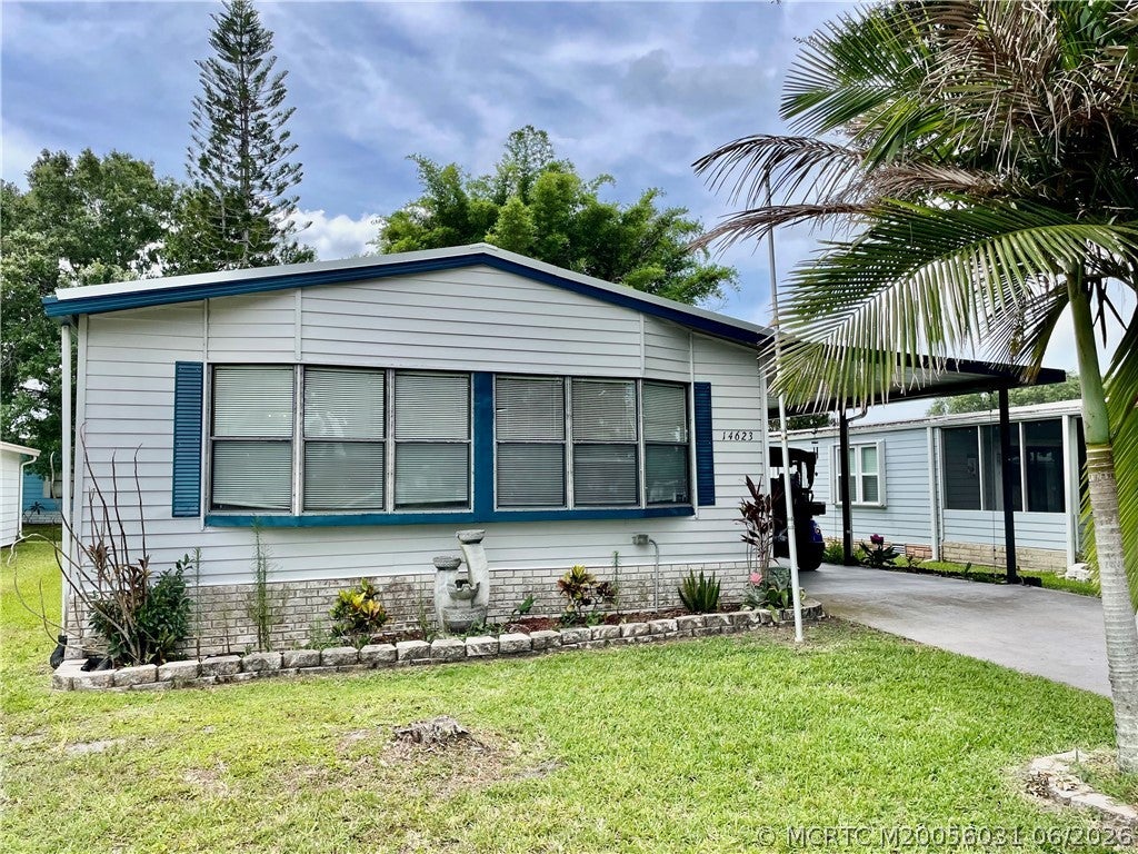 Photo of 14623 Rake Drive SW, Indiantown, FL 34956 (MLS # M20056031)