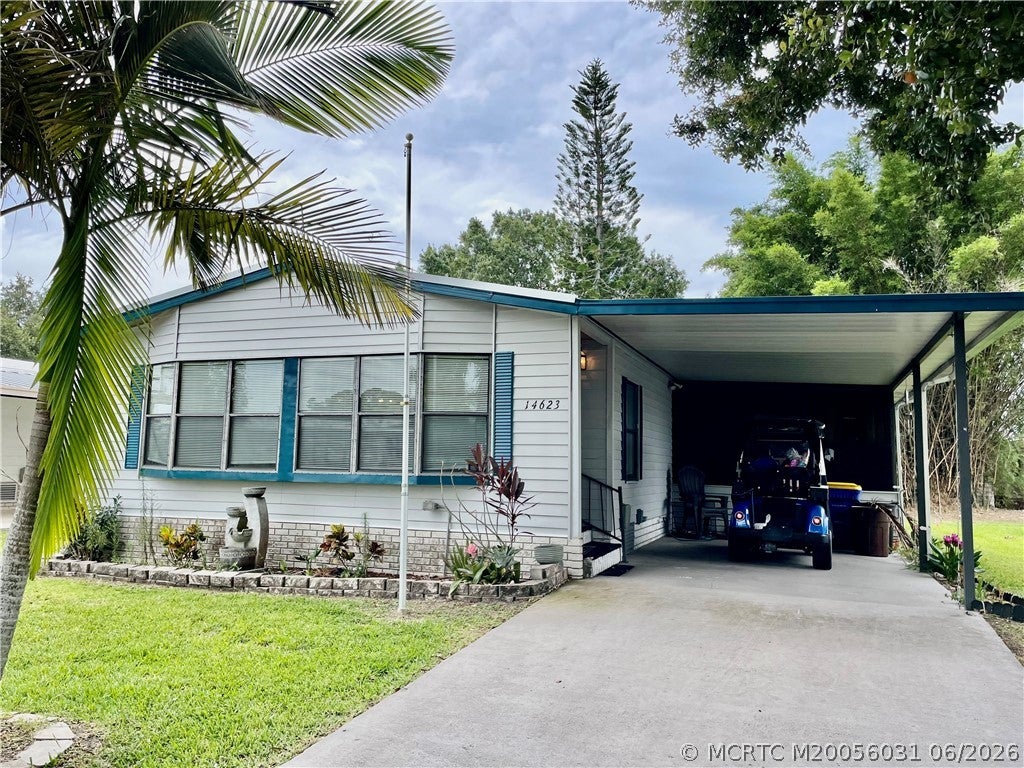 Photo of 14623 Rake Drive SW, Indiantown, FL 34956 (MLS # M20056031)