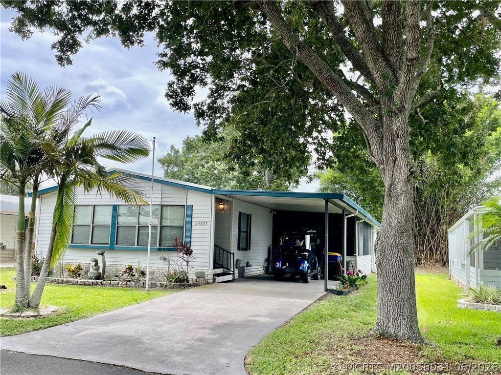 Photo of 14623 Rake Drive SW, Indiantown, FL 34956 (MLS # M20056031)