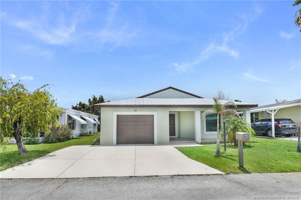 Photo of 10 Kassaba Lane, Port Saint Lucie, FL 34952 (MLS # M20056181)