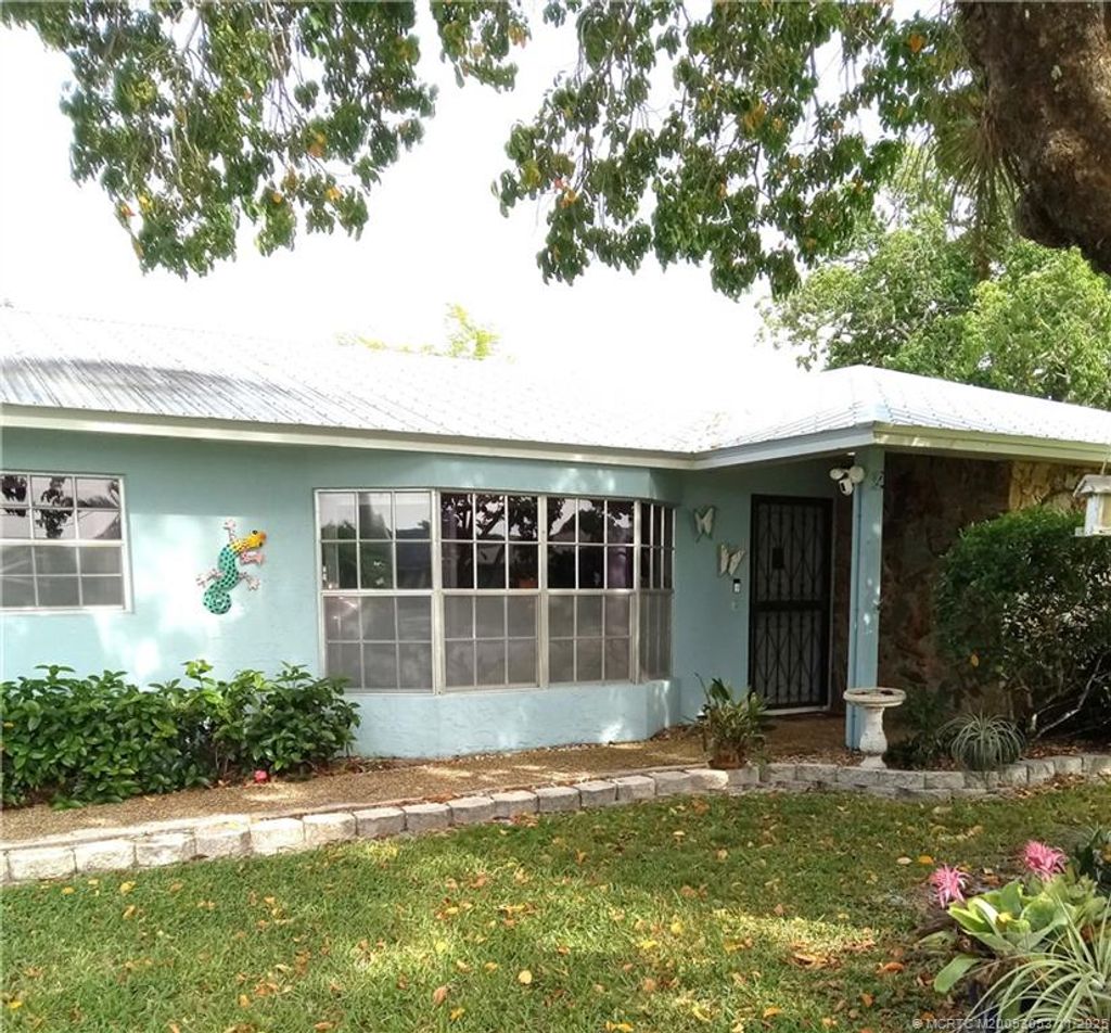 Photo of 477 SW Seabreeze Lane, Port Saint Lucie, FL 34983 (MLS # M20053053)