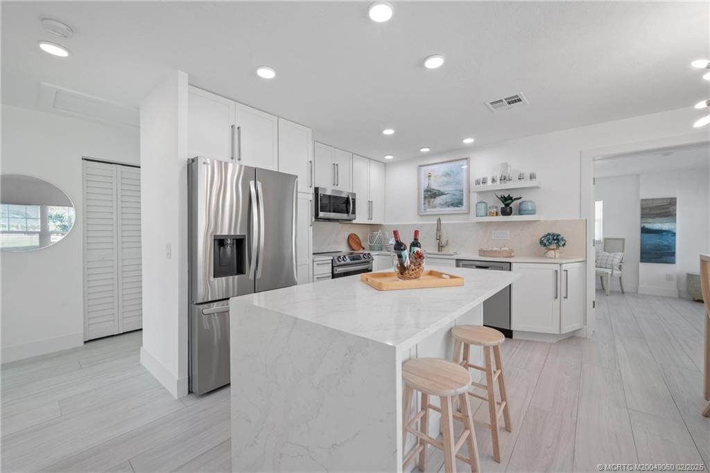 Photo of 656 NE Bernard Street, Jensen Beach, FL 34957 (MLS # M20049050)