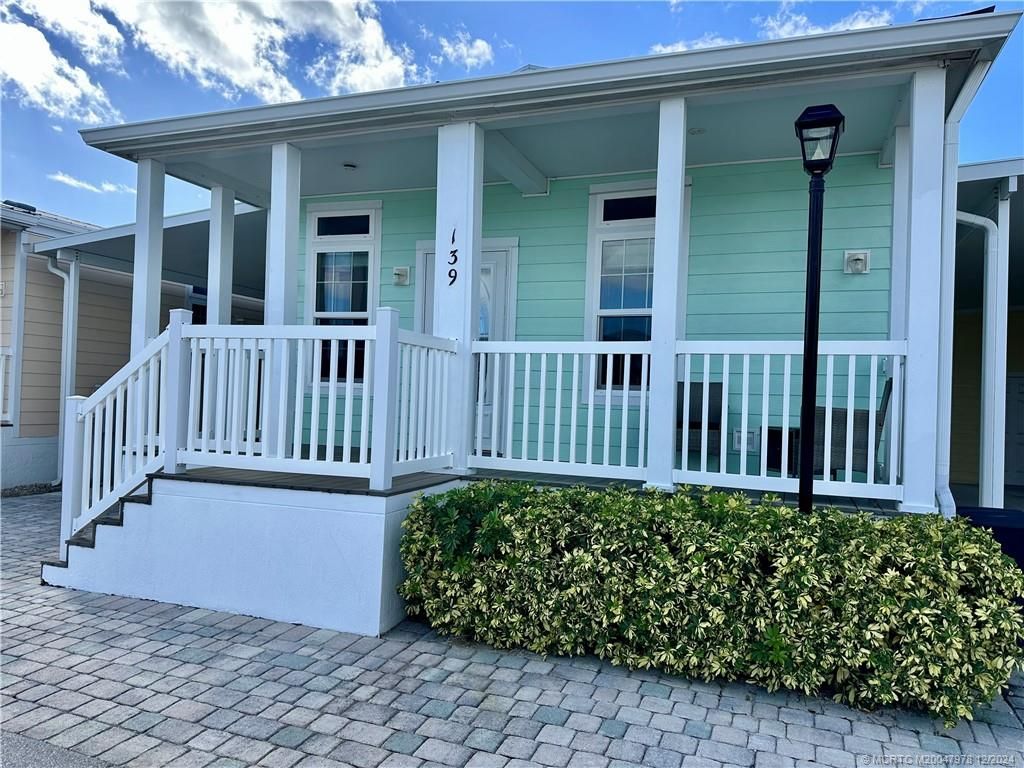 Photo of 139 NE Coastal Drive, Jensen Beach, FL 34957 (MLS # M20047978)