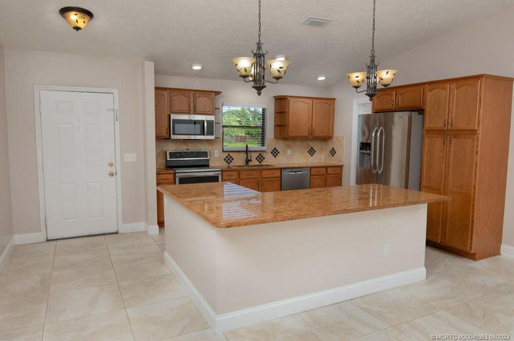 Photo of 4641 SW Hallmark Street, Port Saint Lucie, FL 34953 (MLS # M20040353)