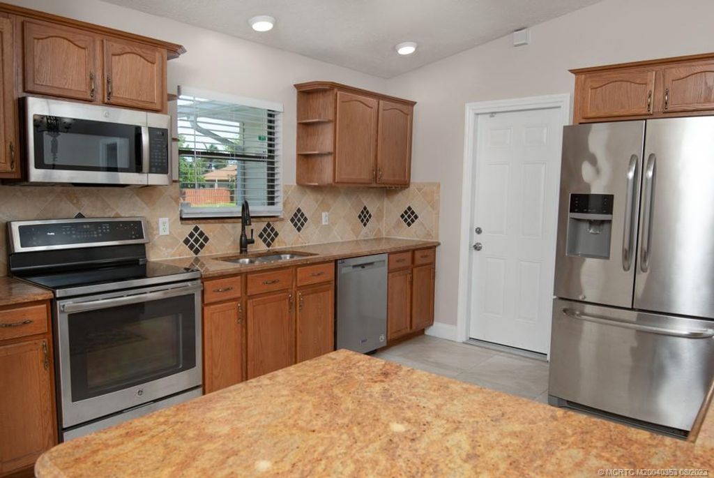 Photo of 4641 SW Hallmark Street, Port Saint Lucie, FL 34953 (MLS # M20040353)