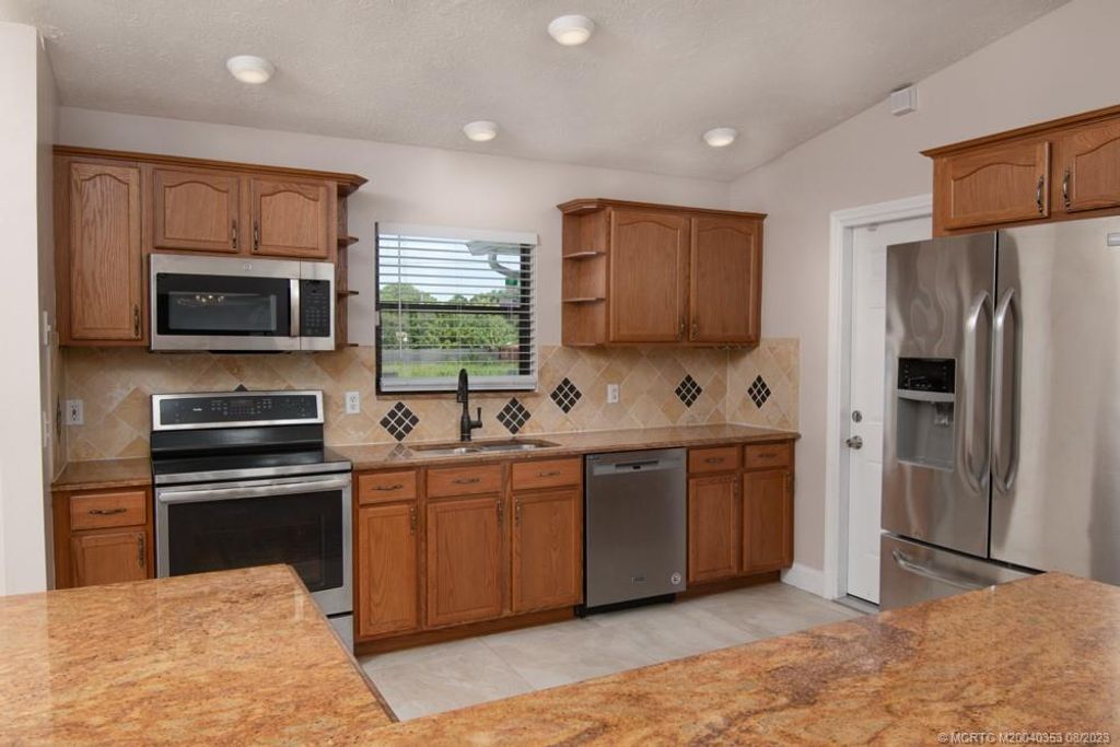 Photo of 4641 SW Hallmark Street, Port Saint Lucie, FL 34953 (MLS # M20040353)