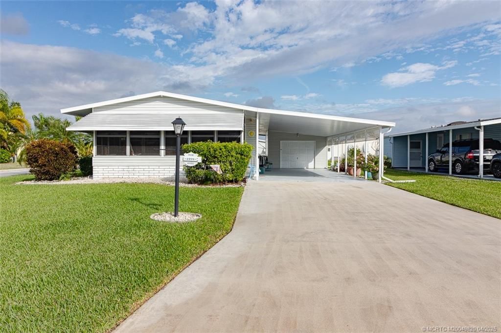 Photo of 2599 SW Marquis Terrace, Stuart, FL 34997 (MLS # M20049820)